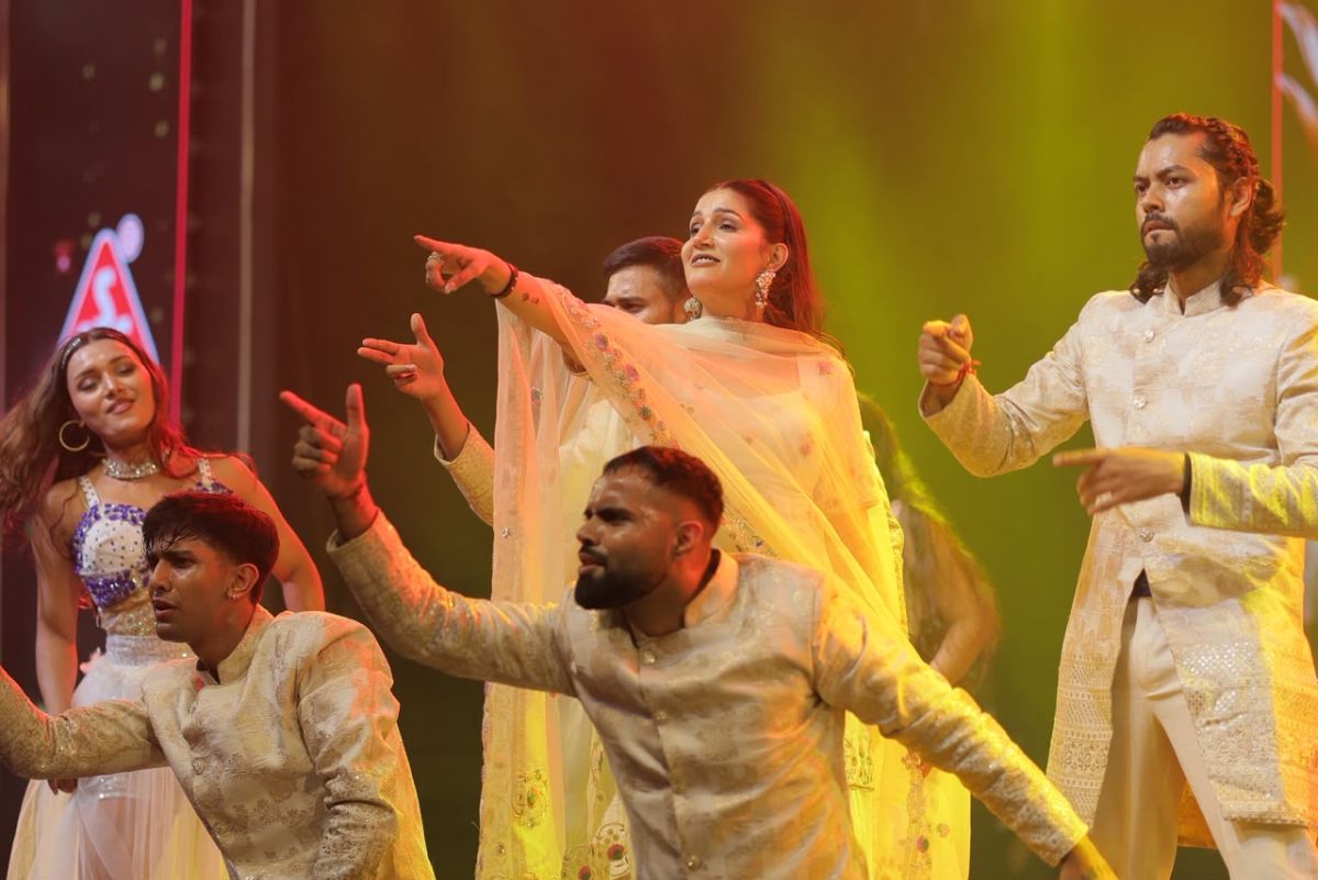 Celebrity performing with dance troupe