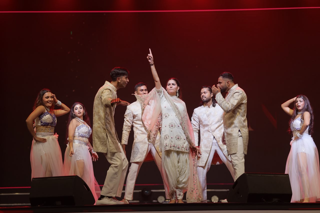 Celebrity performance with dancers on stage