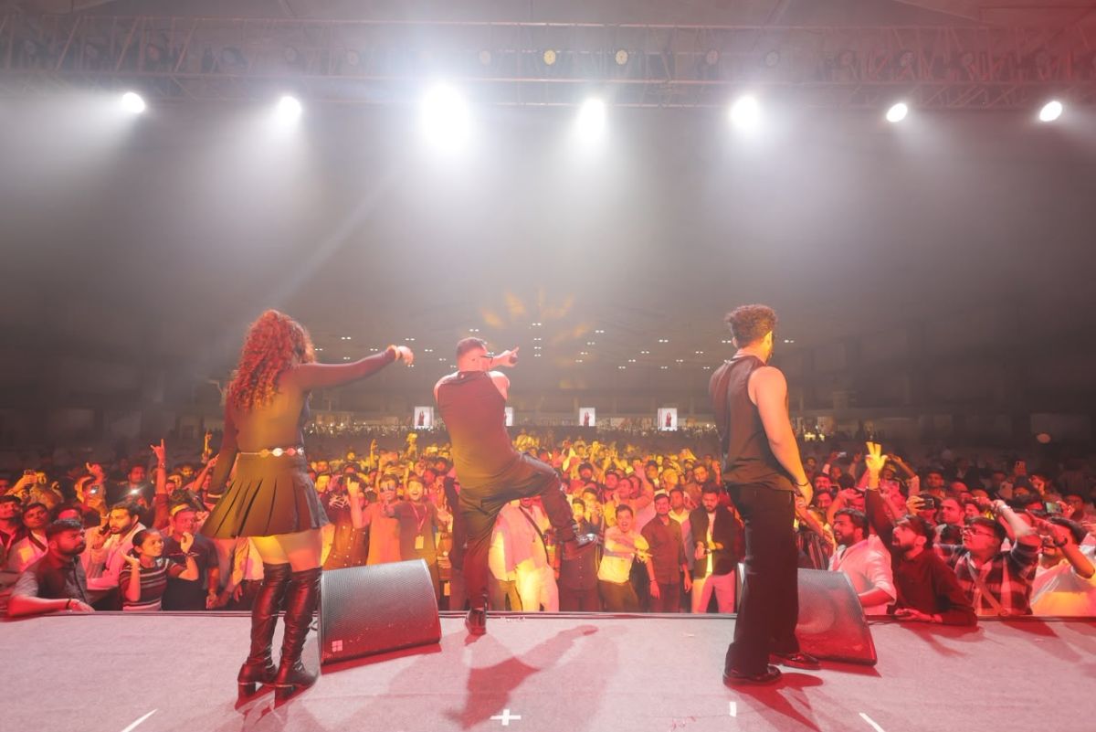 Performers on stage with a packed crowd at SSS Garment Fair entertainment night